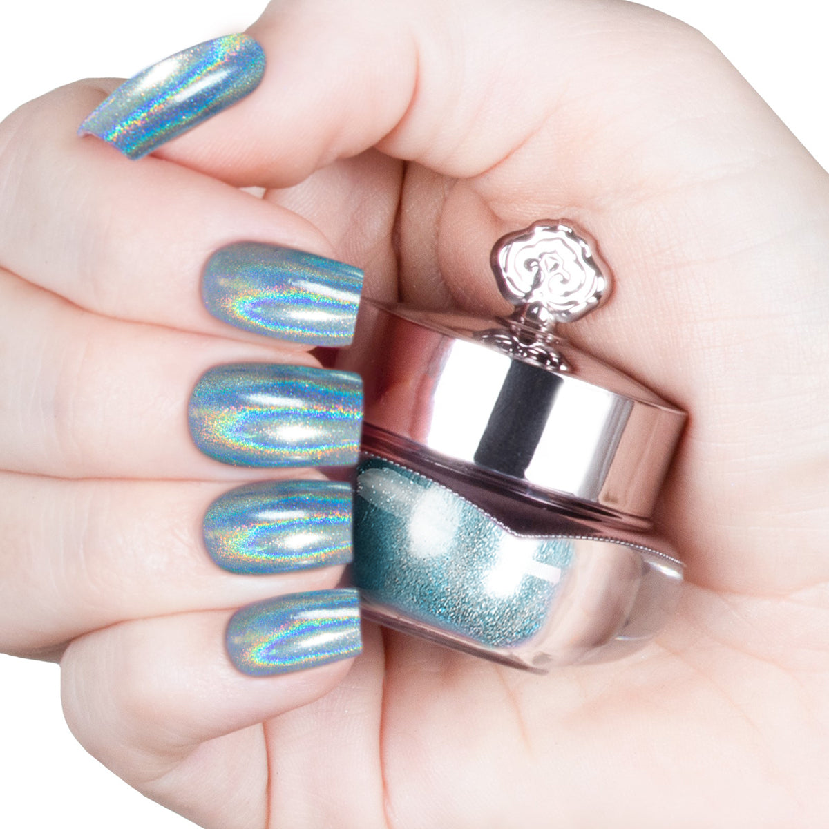 Nails featuring a pale, icy blue holographic powder with a delicate shimmer.
