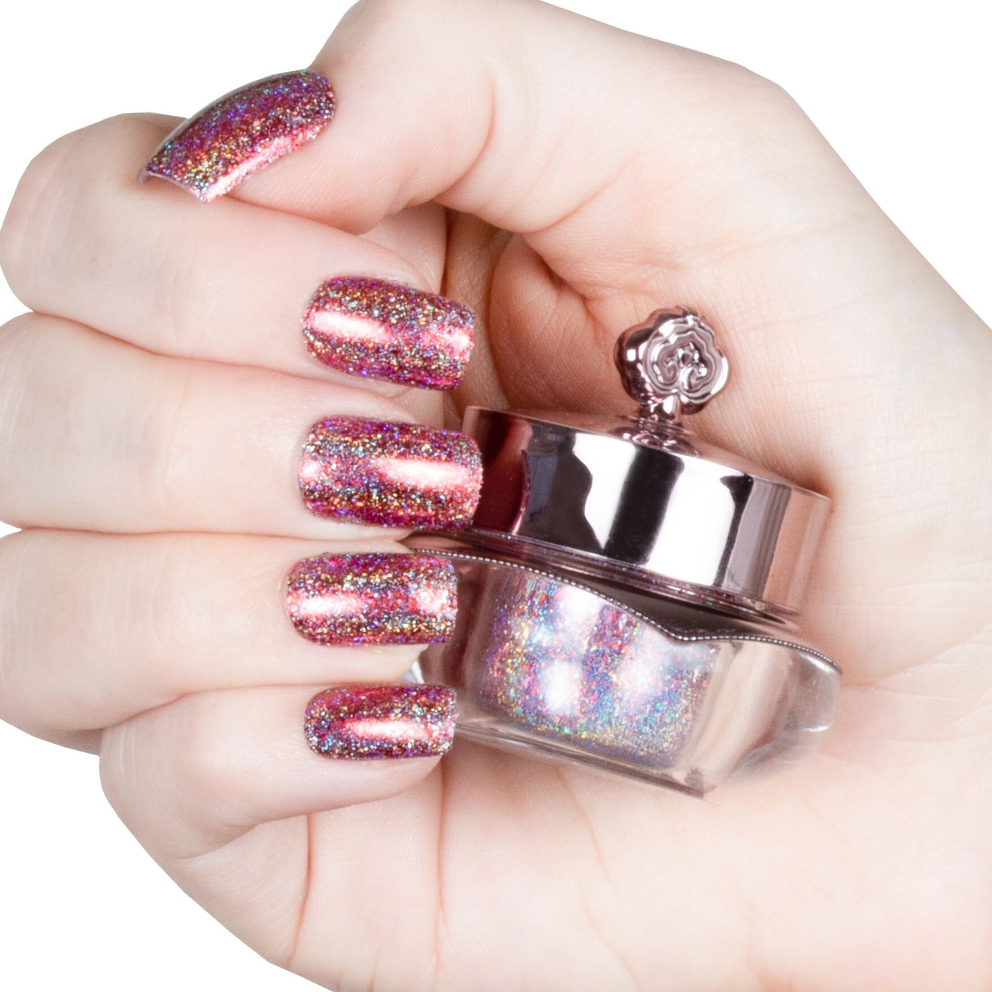 Nails showing shade of pink with holographic shine
