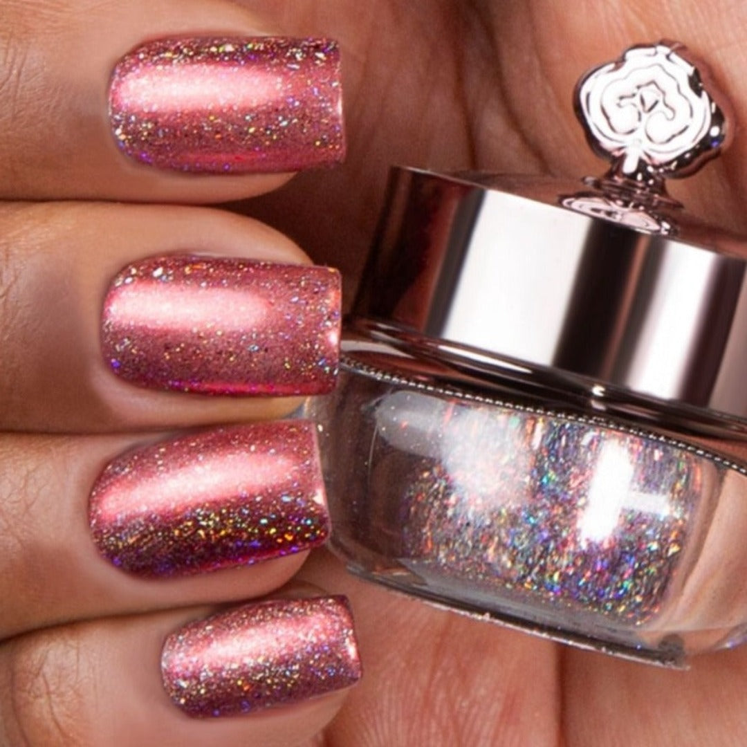 Nails showing shade of pink with holographic shine